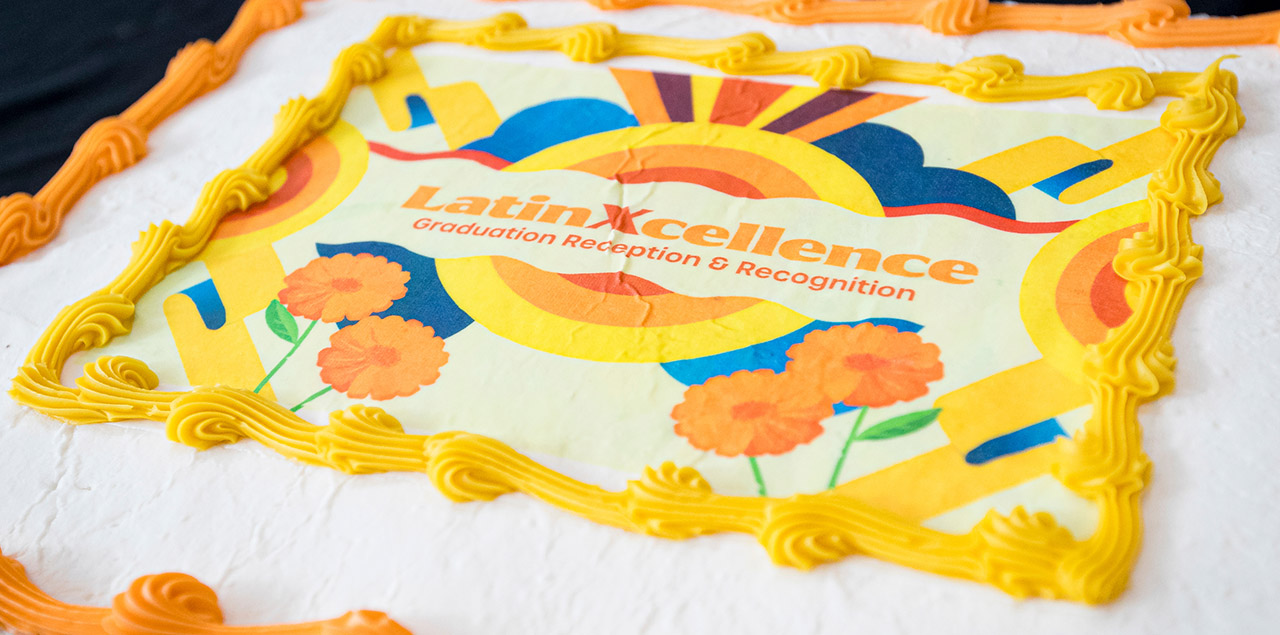 cake with the decoration that reads latinxcellence