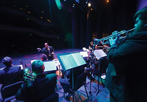  Professor Socrates Garcia conducts his Latin Jazz Orchestra. Photo by Woody Myers
