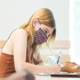 Student in class masked and socially distant