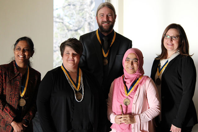Five student awardees, standing, waering medals