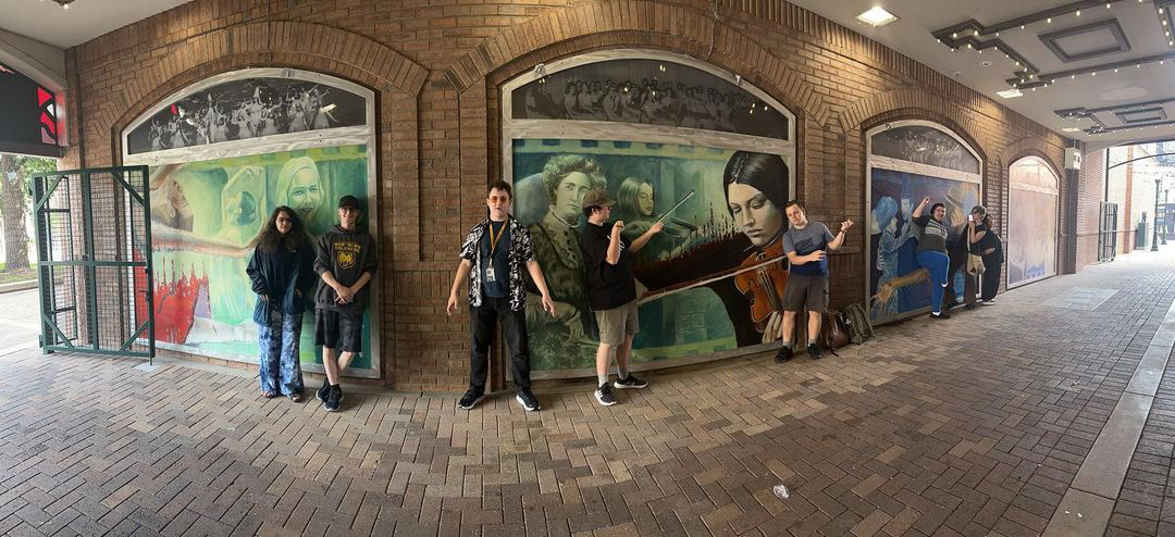 Group of honors students in front of Greeley tunnel mural