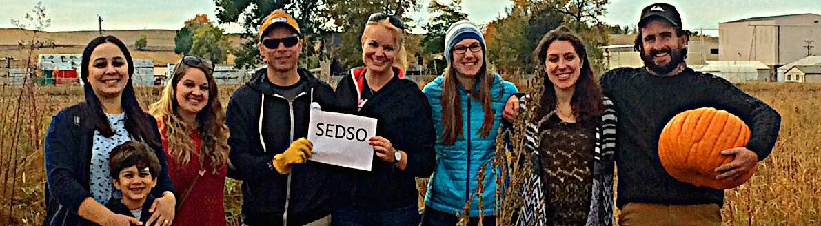 An image of SEDSO members holding pumpkins at the PhD Pumpkin Patch event in Fall of 2016