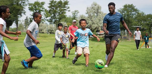 UNC athletes share a game with SWB participants, while also building relationships. “One of my large hopes from the partnership is to see these [UNC] players have a transformed perspective on their capacity to impact others,” says Kilimann, Soccer Without Borders Greeley senior program coordinator.