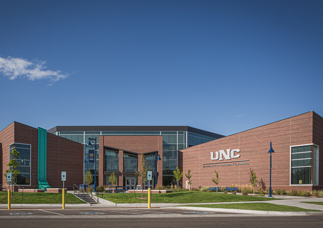 Completed in 2019, Campus Commons is the newest building on campus, located across 11th Avenue from North Hall. The building is a hub for students and prospective students, and houses financial aid, the registrar, the Office of Admissions and Visitor’s Center. It’s also a showcase for UNC’s world-class performing and visual arts programs with the performance hall and an art gallery. A new mural, created by UNC alumnus Armando Silva ’10, was installed in February, 2021.