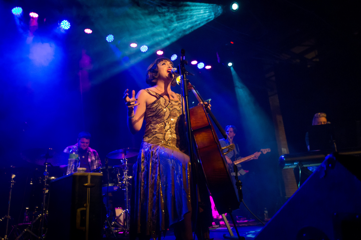 Neyla Pekarek performing with cello on stage