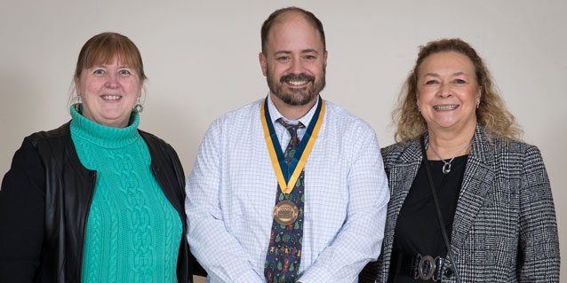 Assistant Provost Kim Black, Chris Tombari, Outstanding Dissertation awardee, and  Professor Linda Vogel