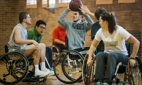Students in Douglas’ Teaching Diverse Populations class play sports such as wheelchair tennis, basketball and rugby; seated volleyball; and boccia. Also, Douglas teaches prospective P.E. teachers and coaches how to modify sports for those with different abilities. Photography by Rob Trubia