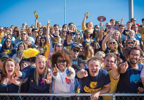 Students show their Bear Pride during the game.