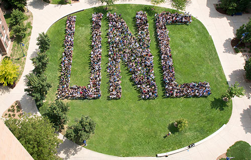 Aerial photo of students forming the letters U-N-C