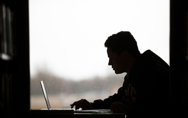 UNC student studies at his computer