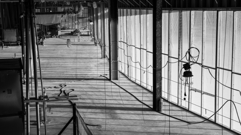Inside of a building that's being constructed in black and white