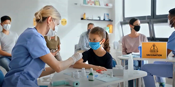 Health care workers giving the COVID-19 vaccine