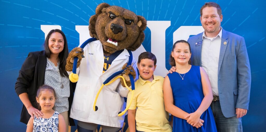 A family posing with Klawz