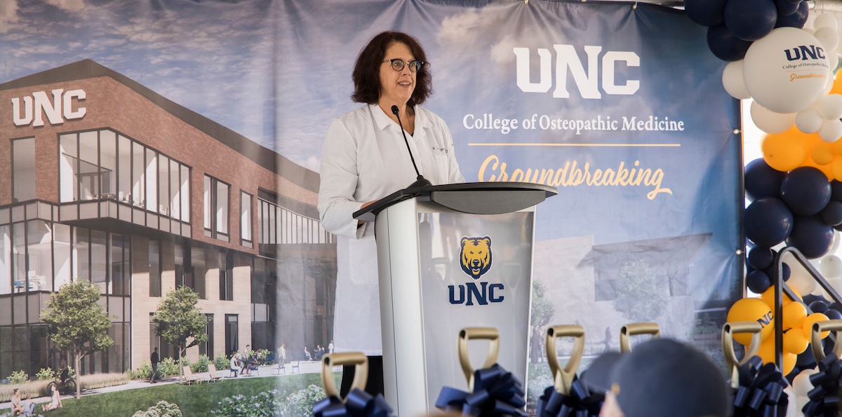 Dr. Longenecker talking to a crowd.