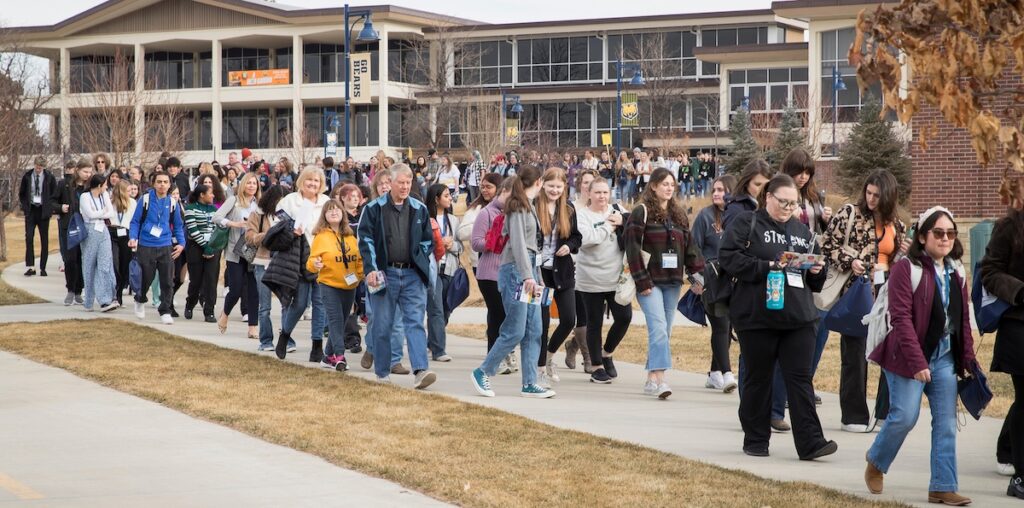Students grabbing food at a buffet