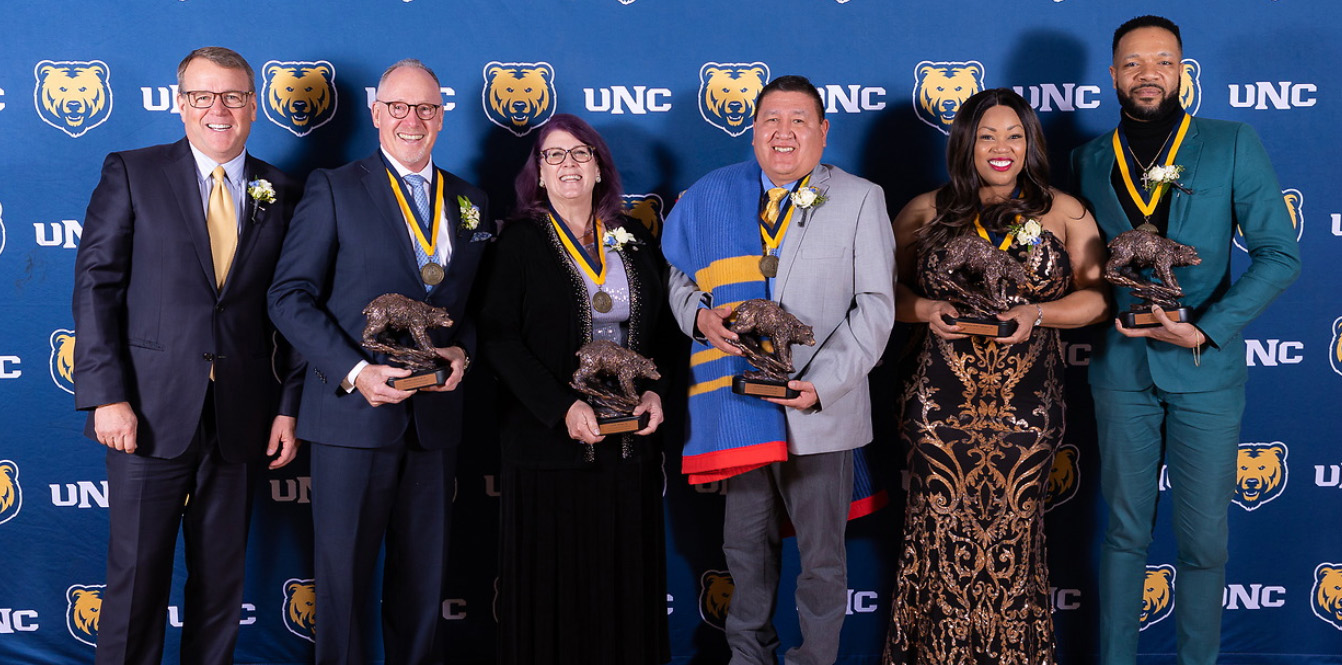 President Feinstein and the five 2023 Honored Alumni holding their awards