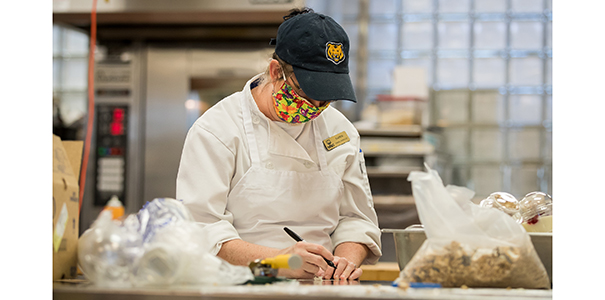 Julia Riley wearing homemade mask while working