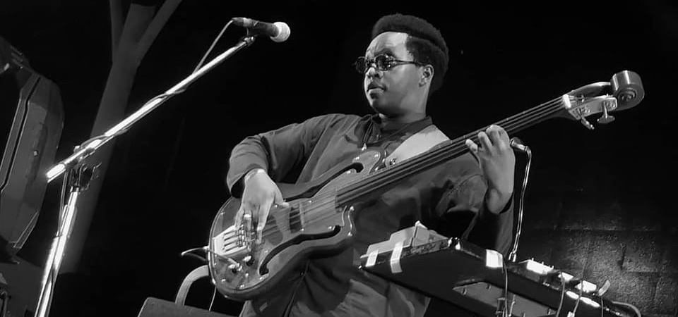 Julian Cary playing the guitar