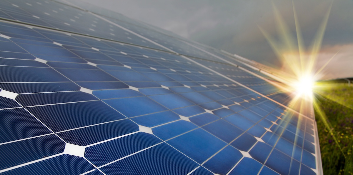 Solar panels with sun shining on them