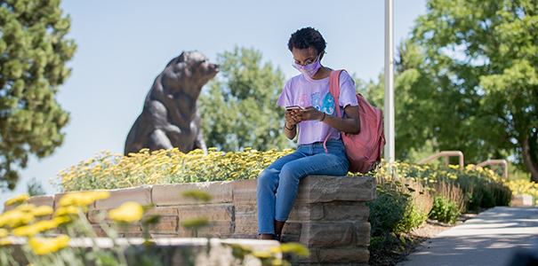 Student using phone on campus