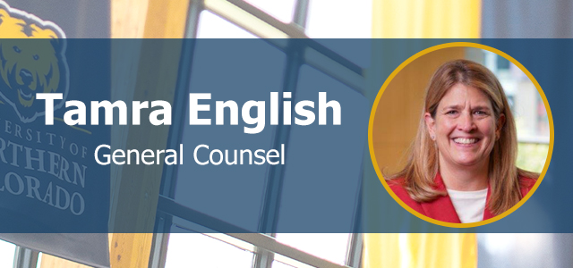 tamra english headshot on background photo of UNC banner