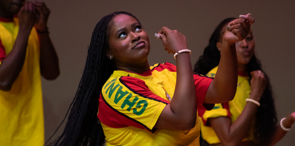 A close up of a woman dancing on stage