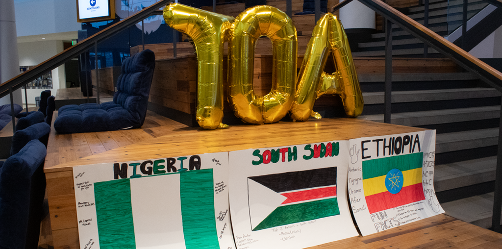 Two posters placed on the ground for people to see