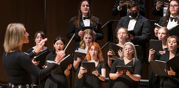 UNC choir members performing on stage