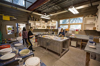 The inside of the arts annex as students craft with clay.