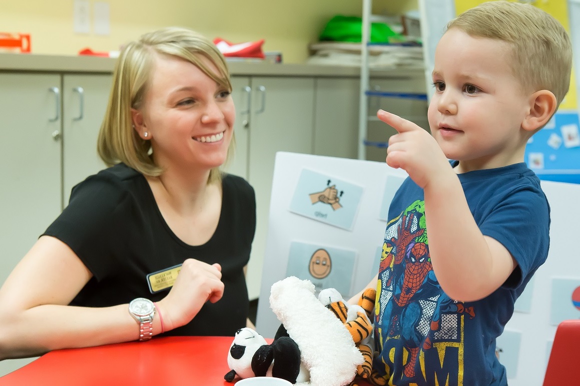 Interpreter interacting with preschool student