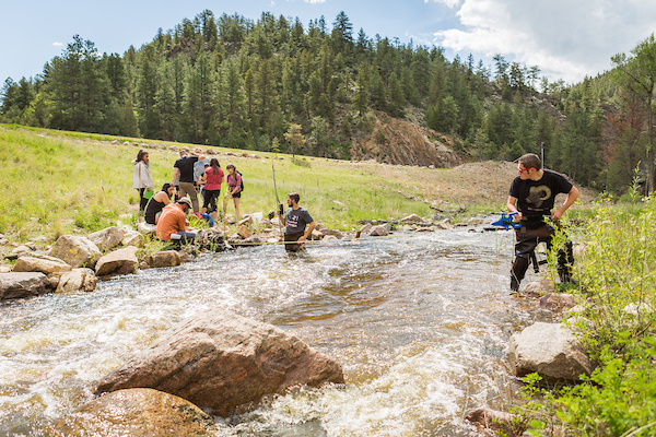 Class conducting reiver research outside.