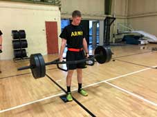 An ROTC college student deadlifting.