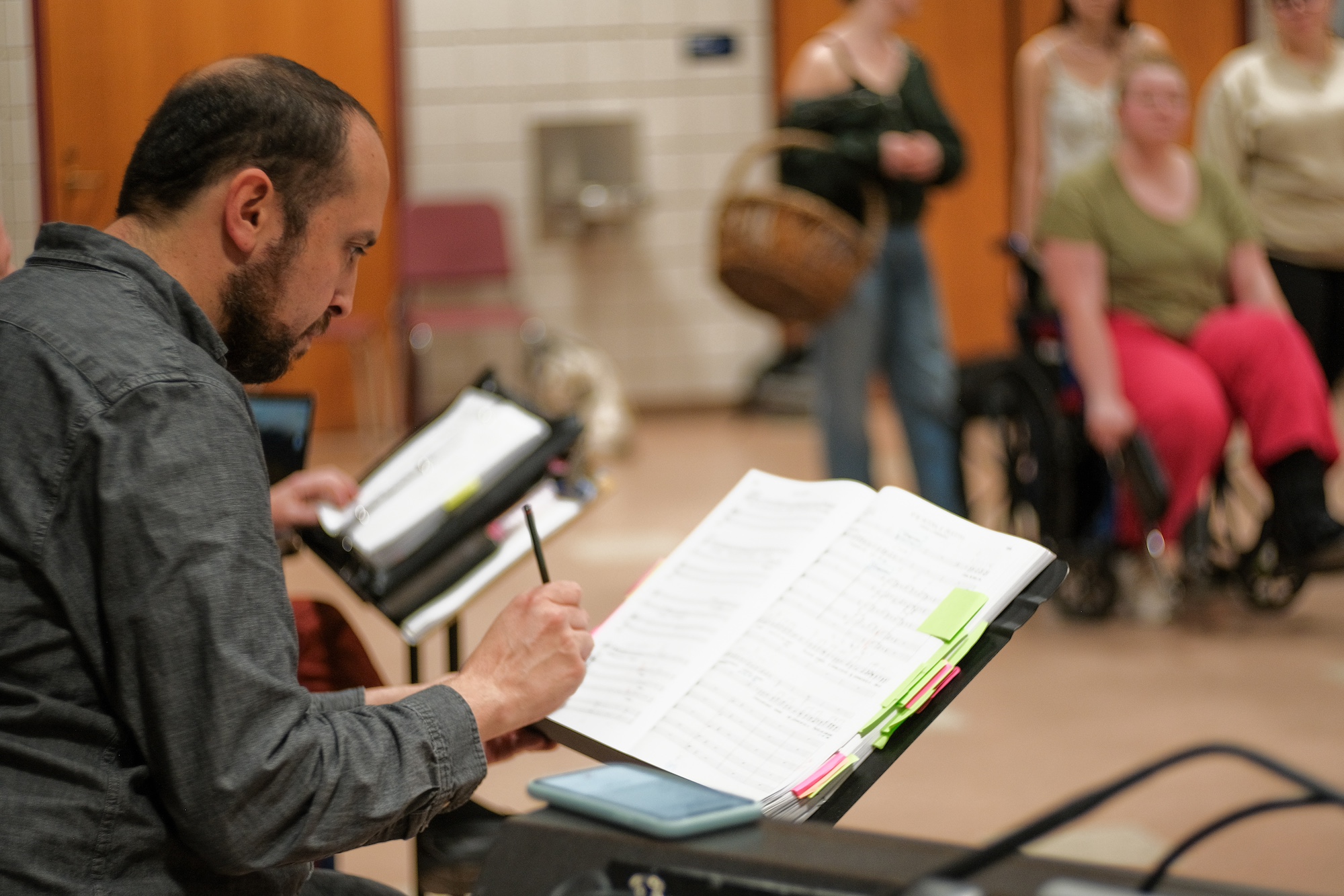 Dr. Andres Jaime rehearsing orchestra.