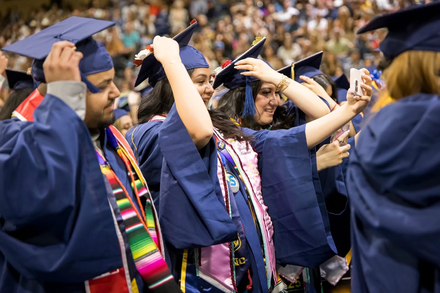 Graduates moving their tassels during UNC ceremony