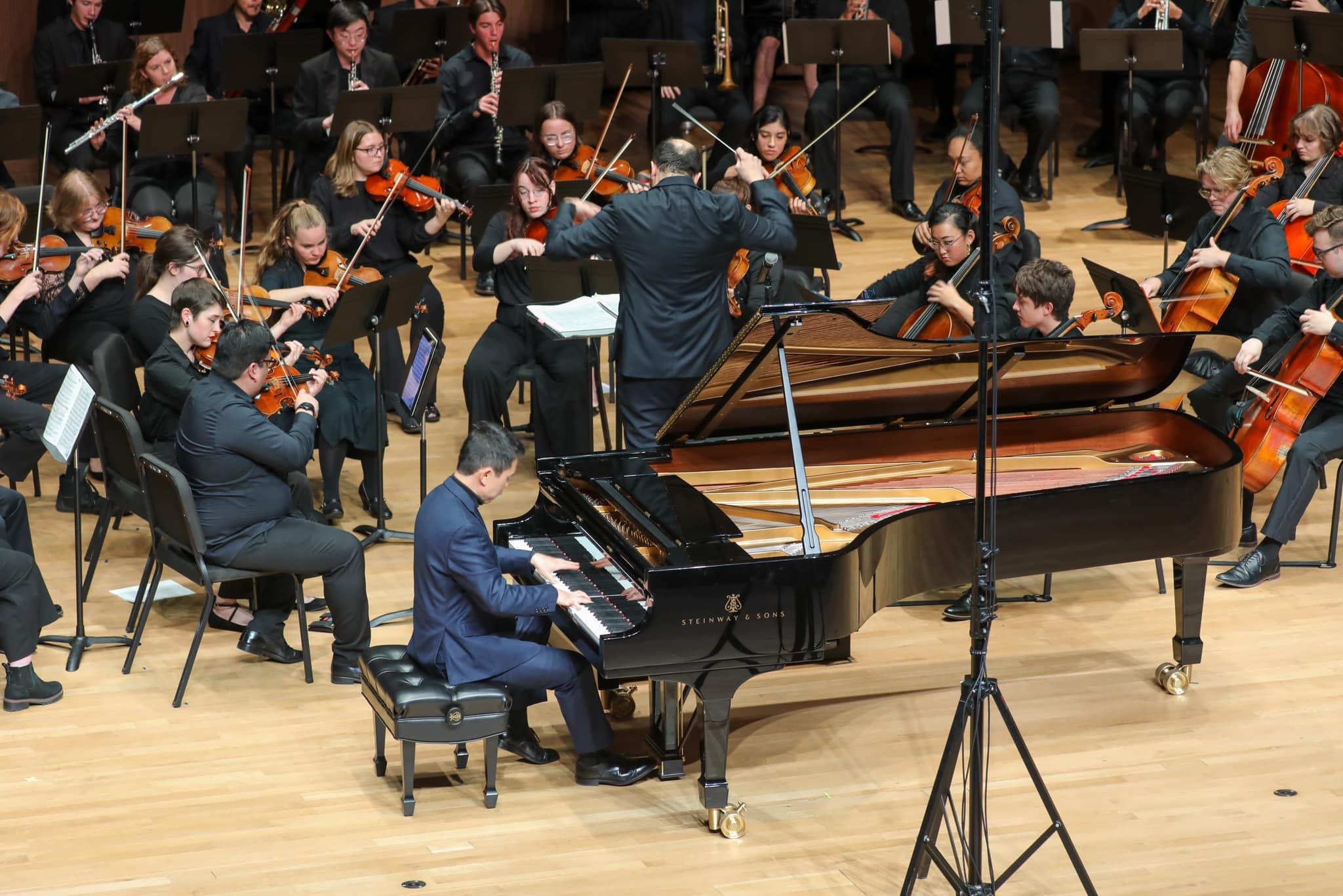 Orchestra performing with Dr. Lei Weng.