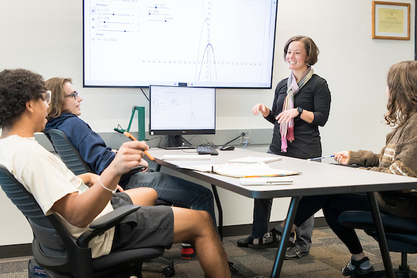 Professor explaining lesson to students.