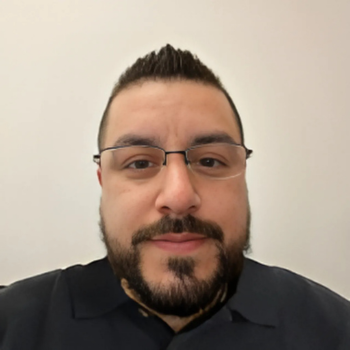 A headshot of Michael Rangel.