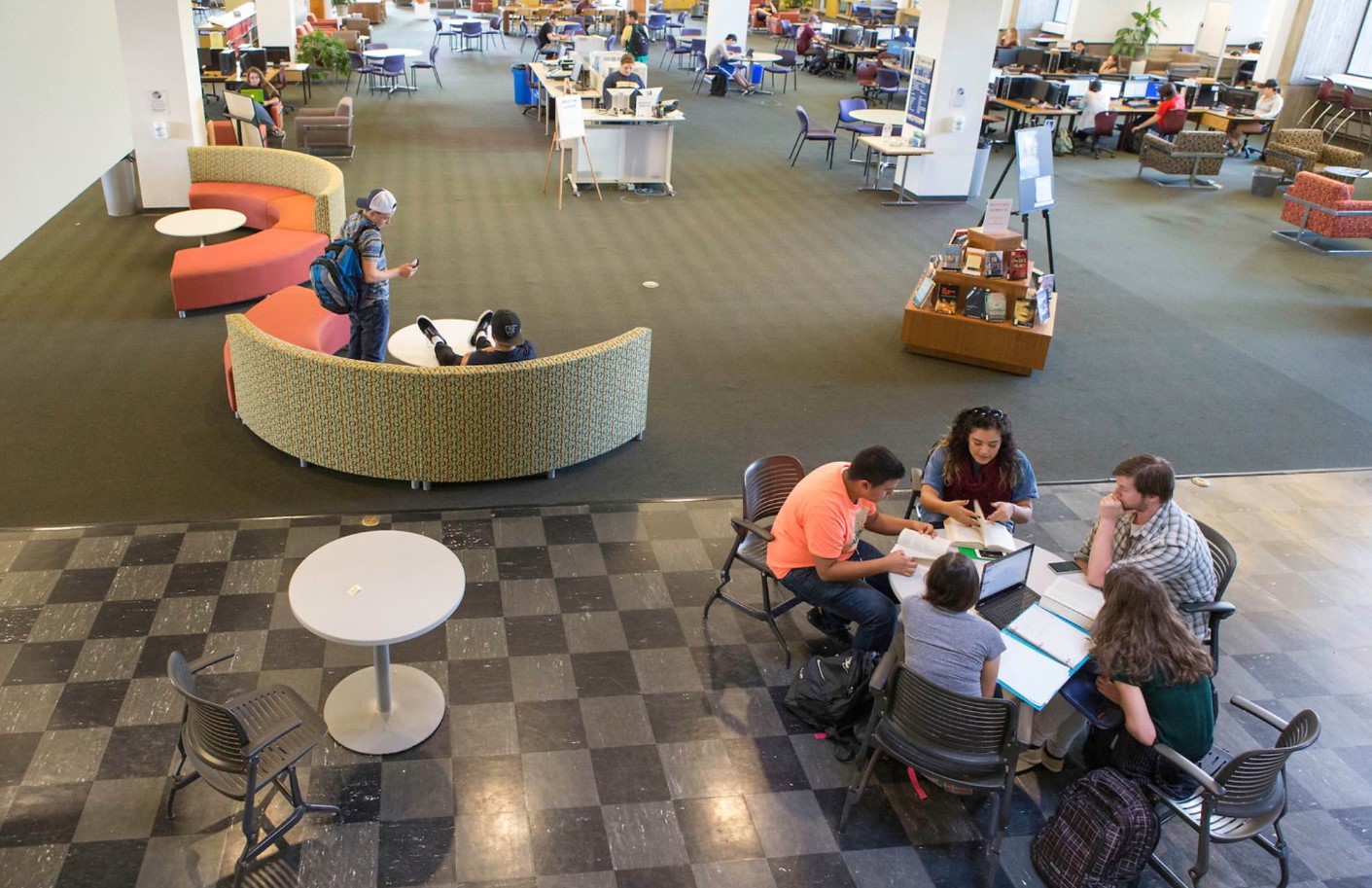 Students working inside Michener Library.