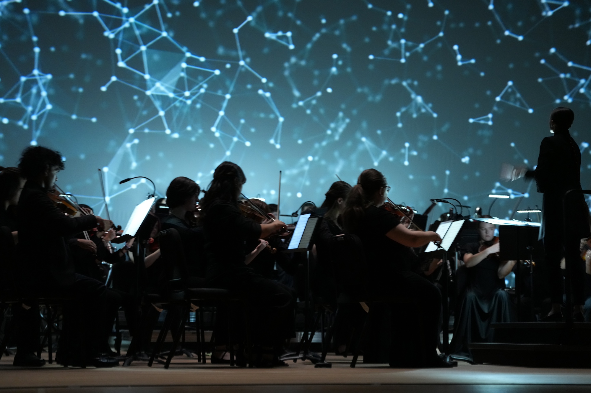 Orchestra performing in Exploring musical worlds.