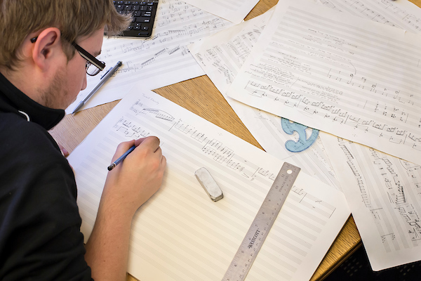 Music composition student working.
