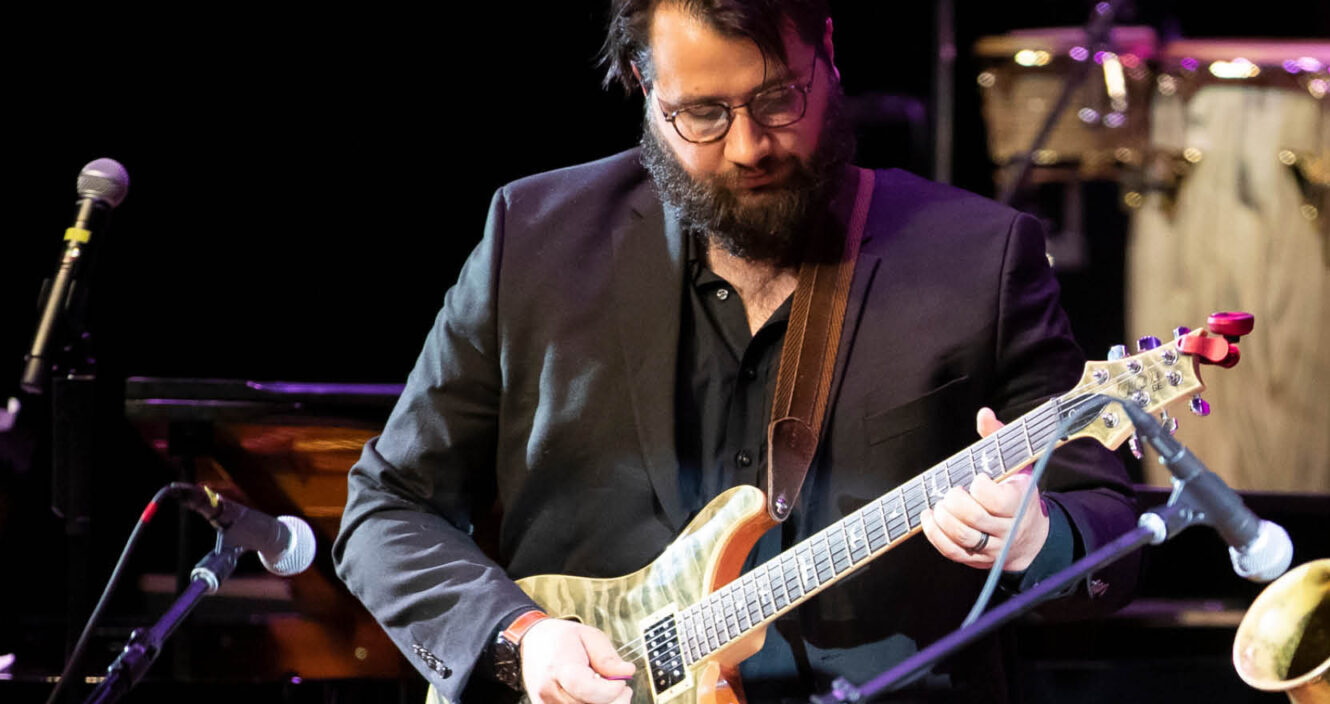 Student playing jazz guitar.