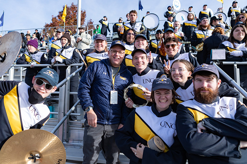 Students in marching band with President Feinstein.