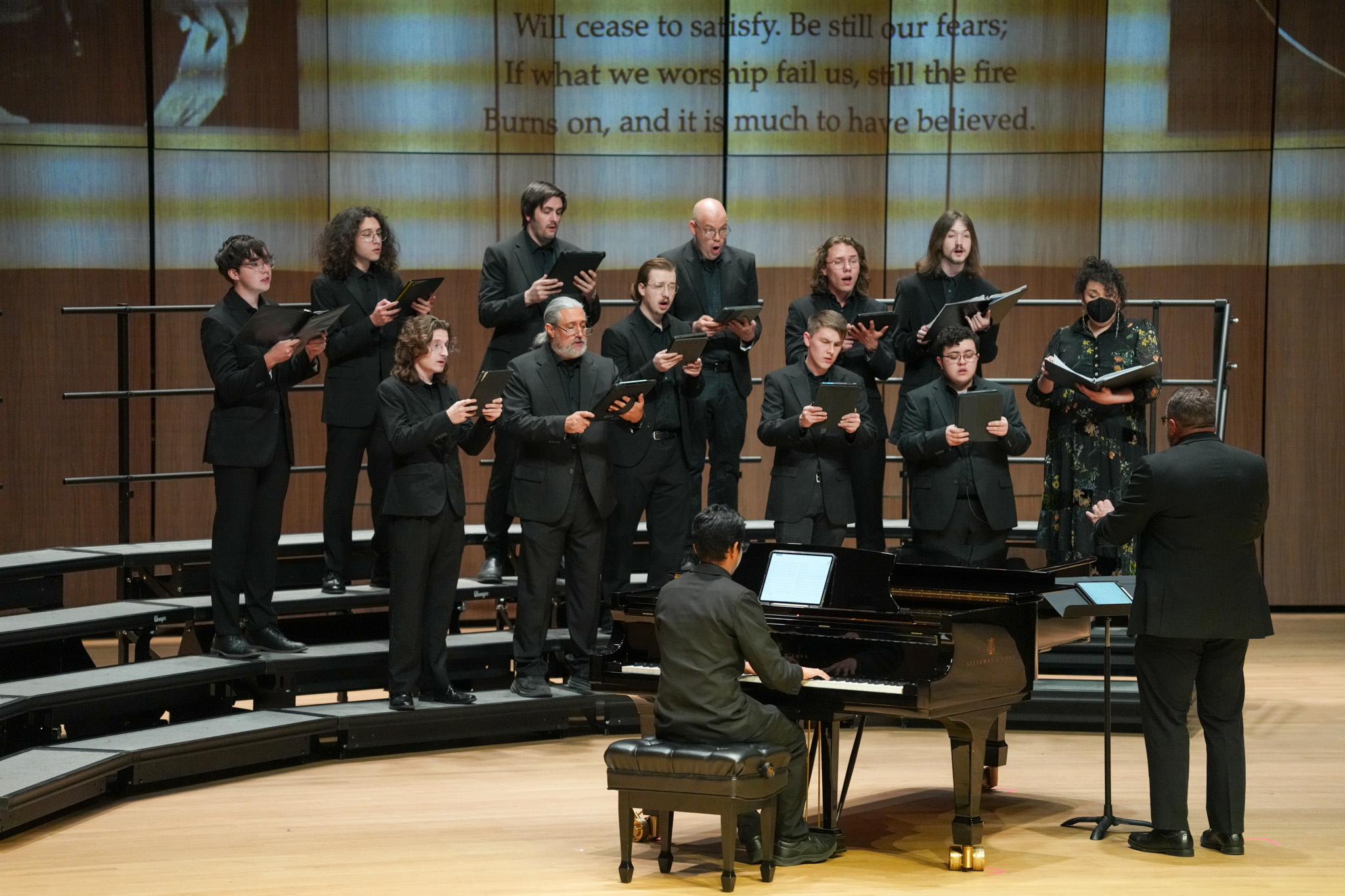 Tenor & bass choir performing.