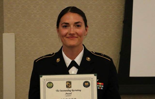 A UNC & CSU cadet accepting an award.