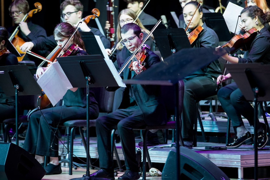 Strings performing in the jazz Travelogue concert in 2024.
