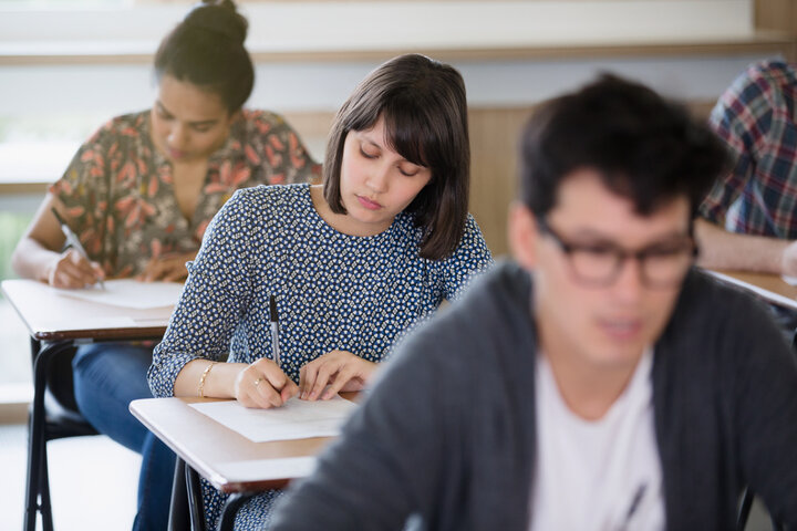 Three students in a classroom