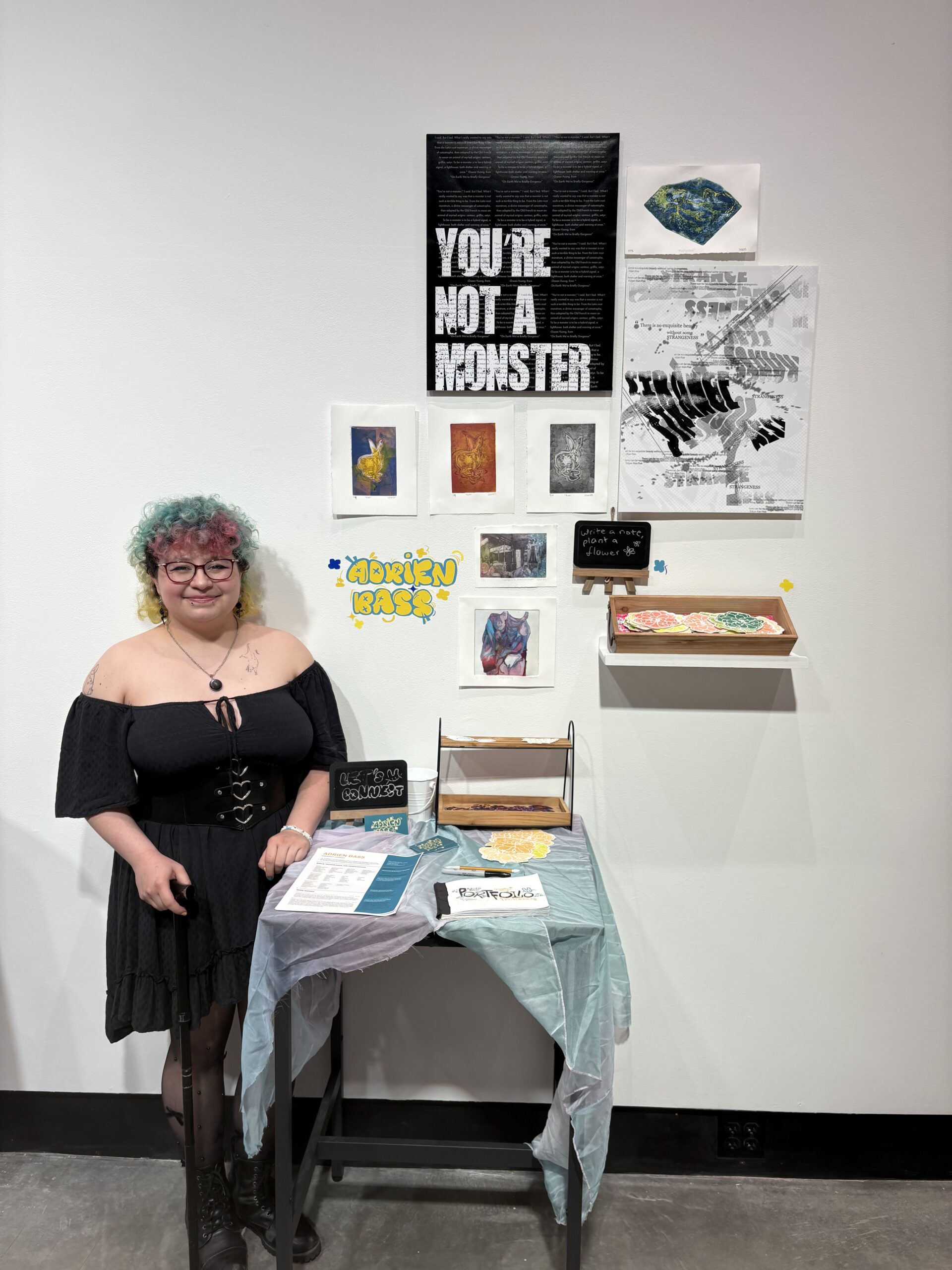 Student Adrien Bass and their artwork.