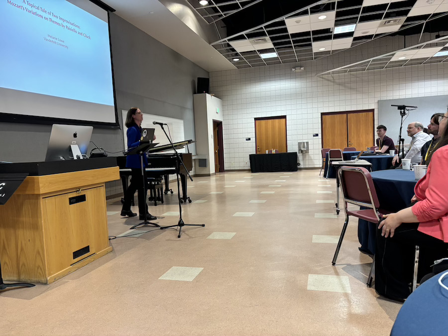 Presenter speaking at the 2nd International Symposium on Musical Topics and Topic Theory, 2025.
