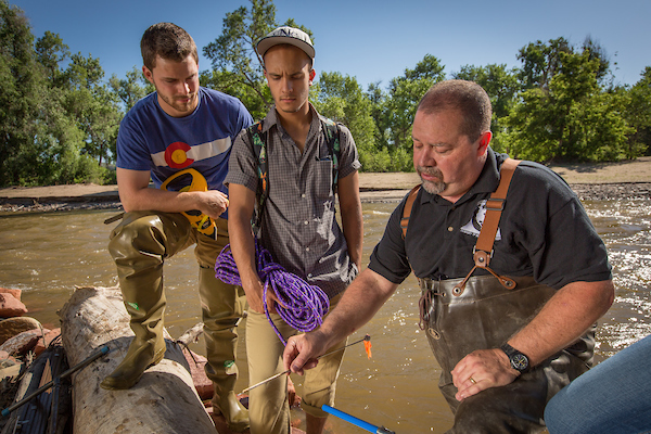 Dean James Doerner participating in a lab with students