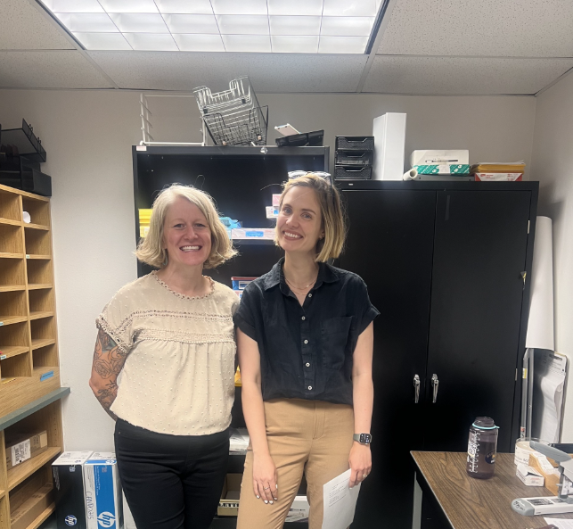 Professor Kelly Langley-Cook and Dr. Caitlin Monroe standing together.